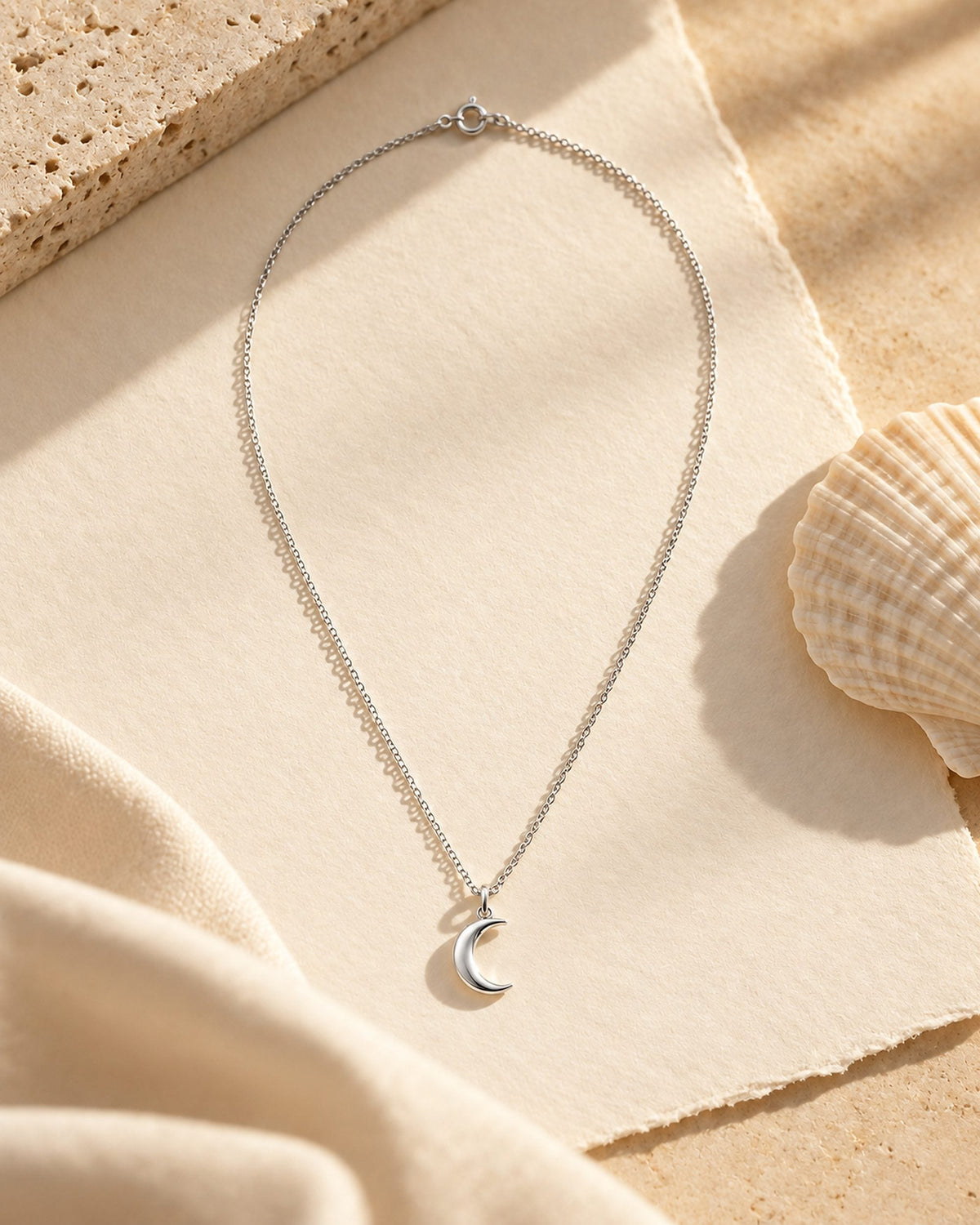 Collier Luna argent sur papier coton